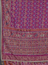 Regal purple art patola silk saree with ornate embellishments