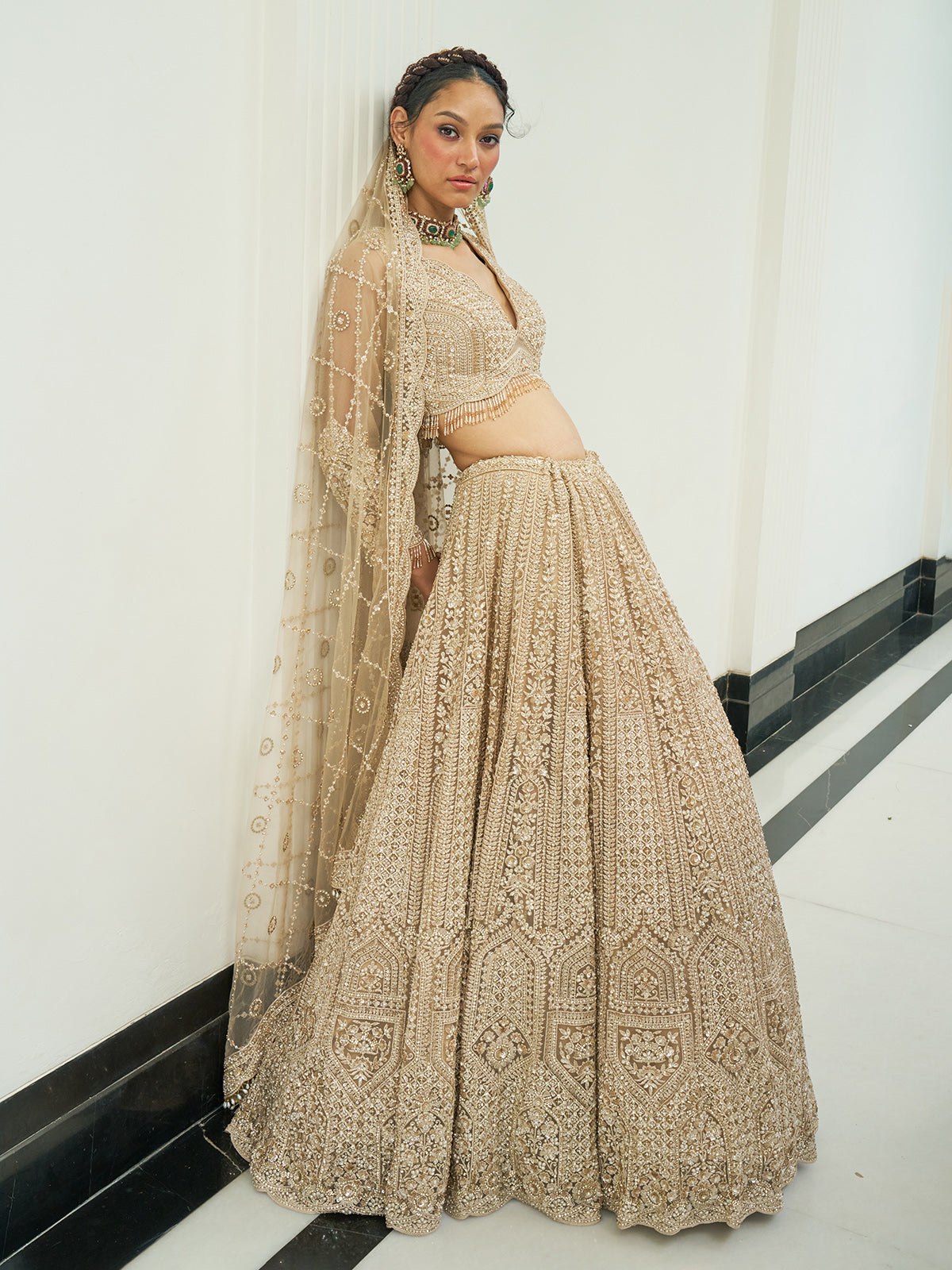Beige net heavy embroidered lehenga choli with diamond and cutdana