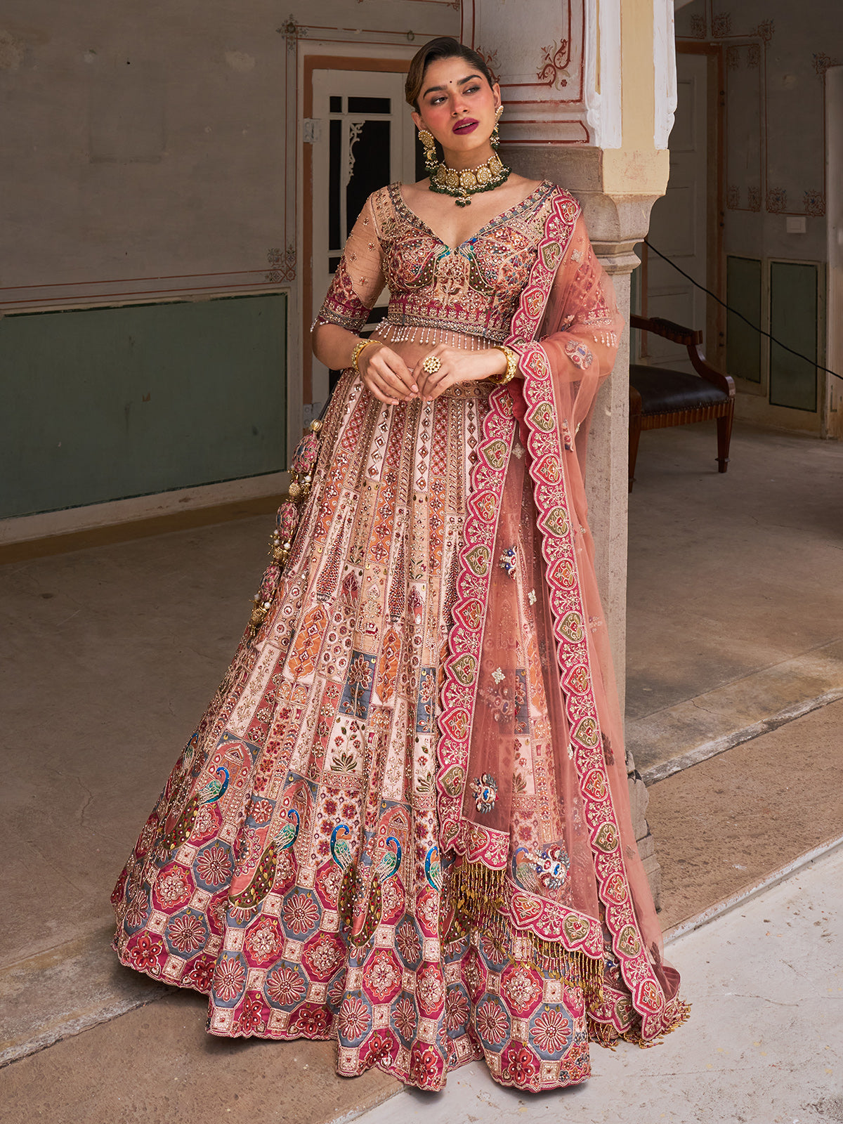 Cream silk net designer lehenga choli with multicolor resham work