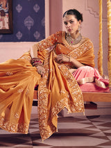 Pastel orange viscose zari tissue saree with embellished border