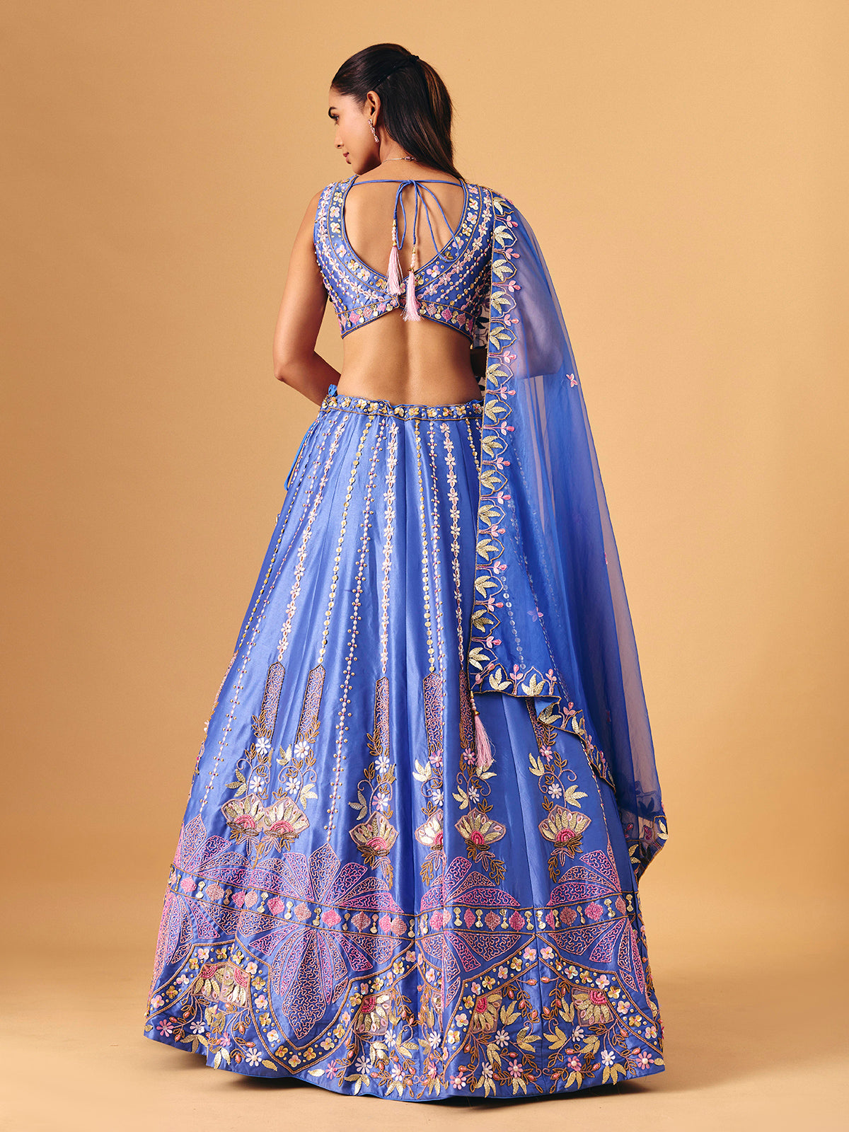 Royal blue silk lehenga choli with pearl embellished artistry