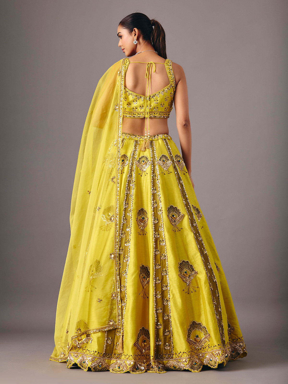Lemon yellow raw silk lehenga choli with pearl embellishments