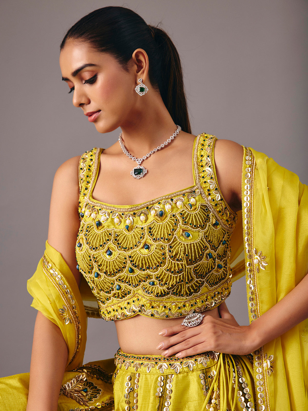 Lemon yellow raw silk lehenga choli with pearl embellishments