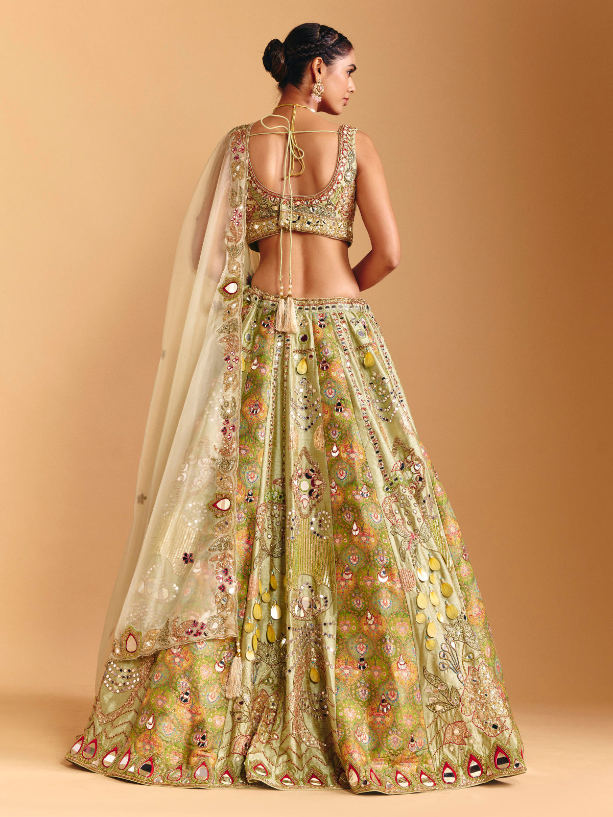 Pista green raw silk lehenga choli with printed artistry