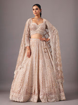 Beige net lehenga choli with pearl and sequin detailing