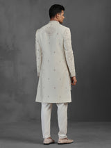 Beige silk groom sherwani with intricate embroidery