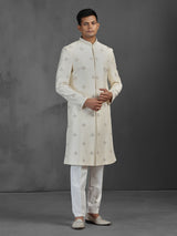 Cream silk wedding sherwani with butti work