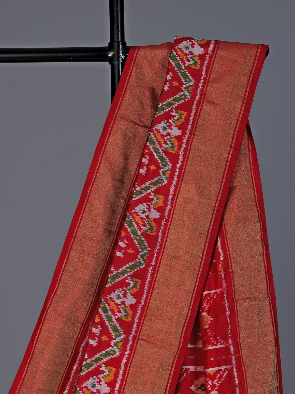 Red patola silk saree with contrast zari border
