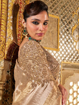 Gold shimmer tissue silk saree with subtle textured drape