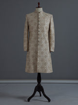 Beige silk sherwani with rich resham and zardosi accents