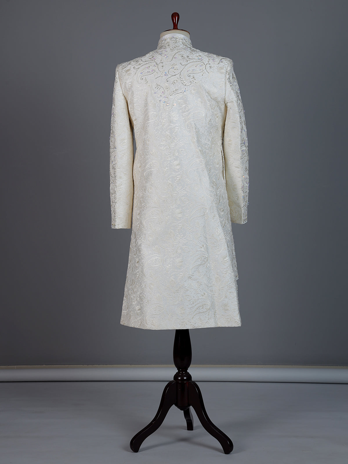 White raw silk sherwani with intricate embroidery and stone detailing