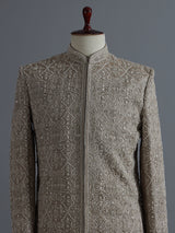 Beige silk sherwani with floral resham work and embroidered dupatta