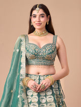 Pastel green silk lehenga choli with floral motifs