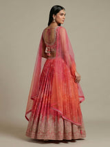 Pink silk bandhej lehenga choli with mirror and tassel work