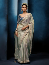 Pista green tissue silk saree with bold navy blouse