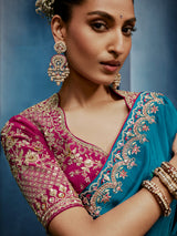 Blue silk saree paired with a striking red blouse