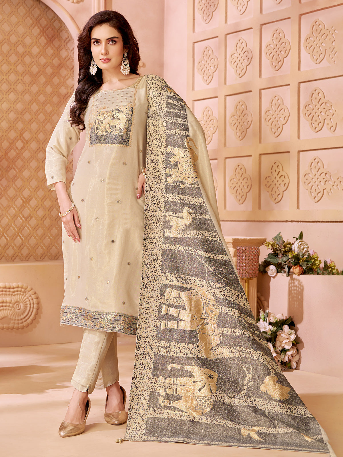 Cream silk straight cut salwar suit with elephant motifs