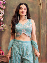 Blue silk palazzo suit with tassel embellishments