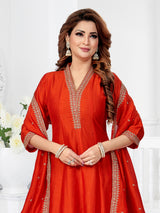 Rust orange silk anarkali suit with festive shimmer