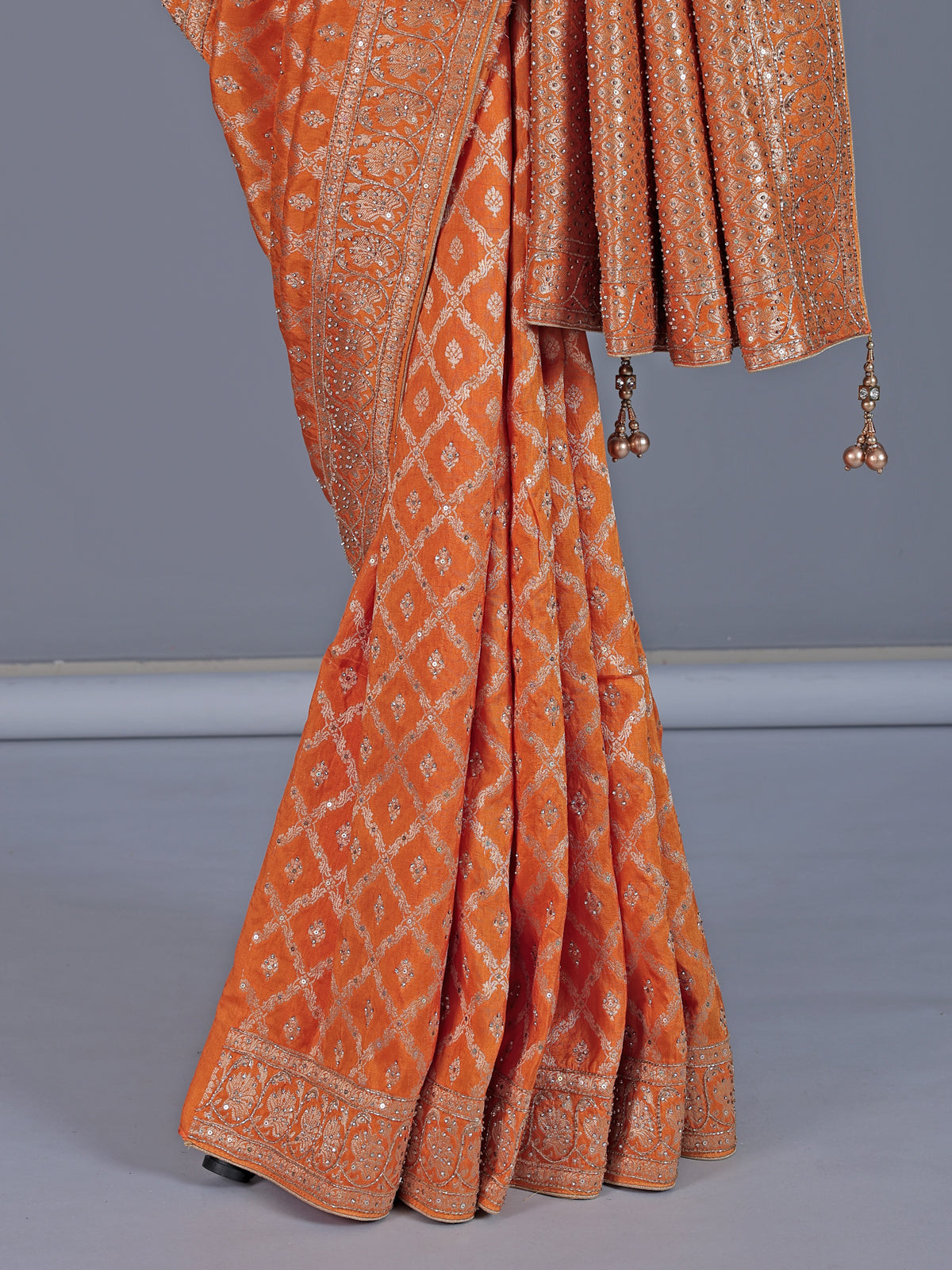 Light orange dola silk saree with zari jal detailing
