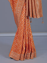 Light orange dola silk saree with zari jal detailing