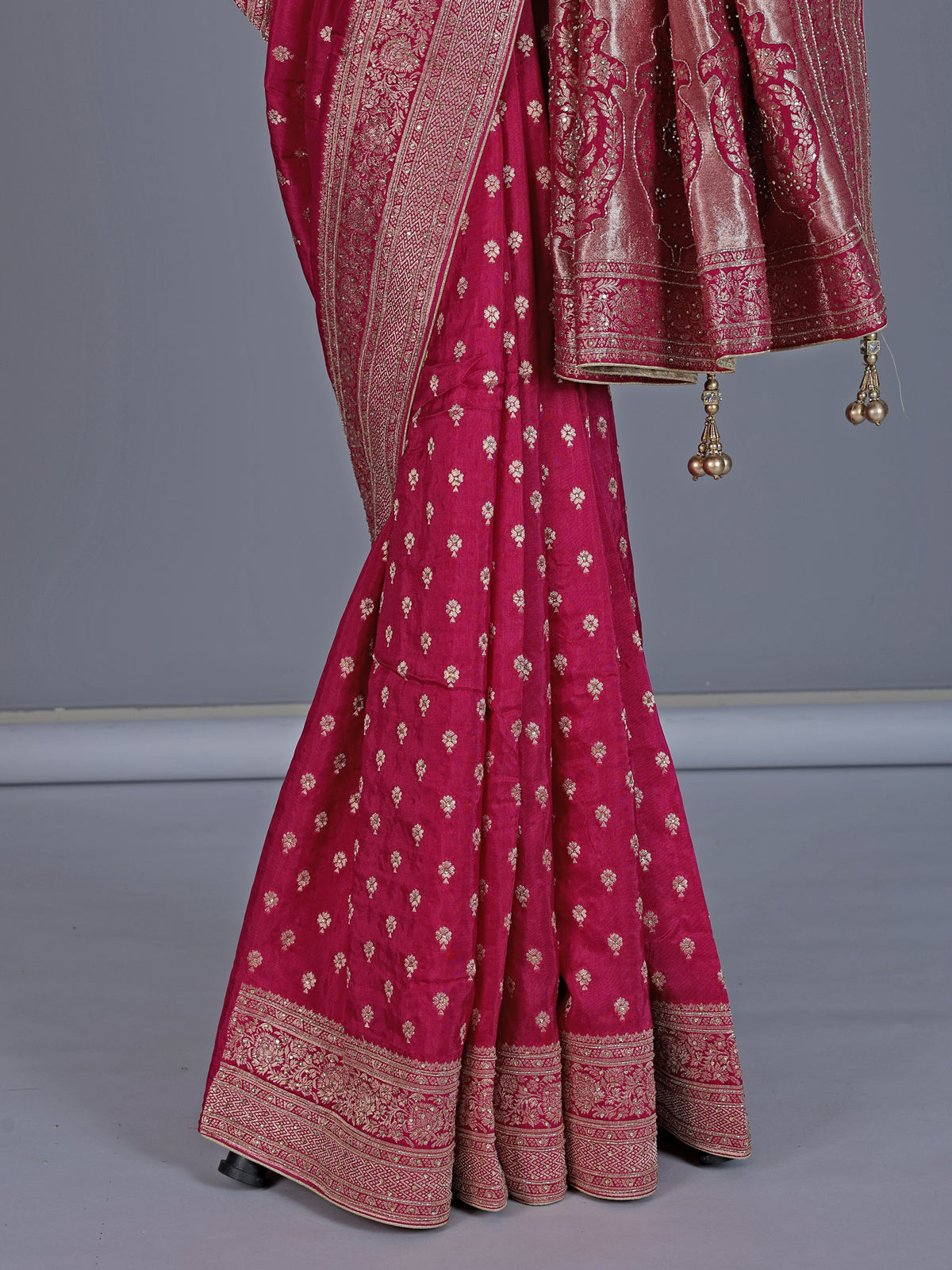 Maroon dola silk saree with rich zari butti design