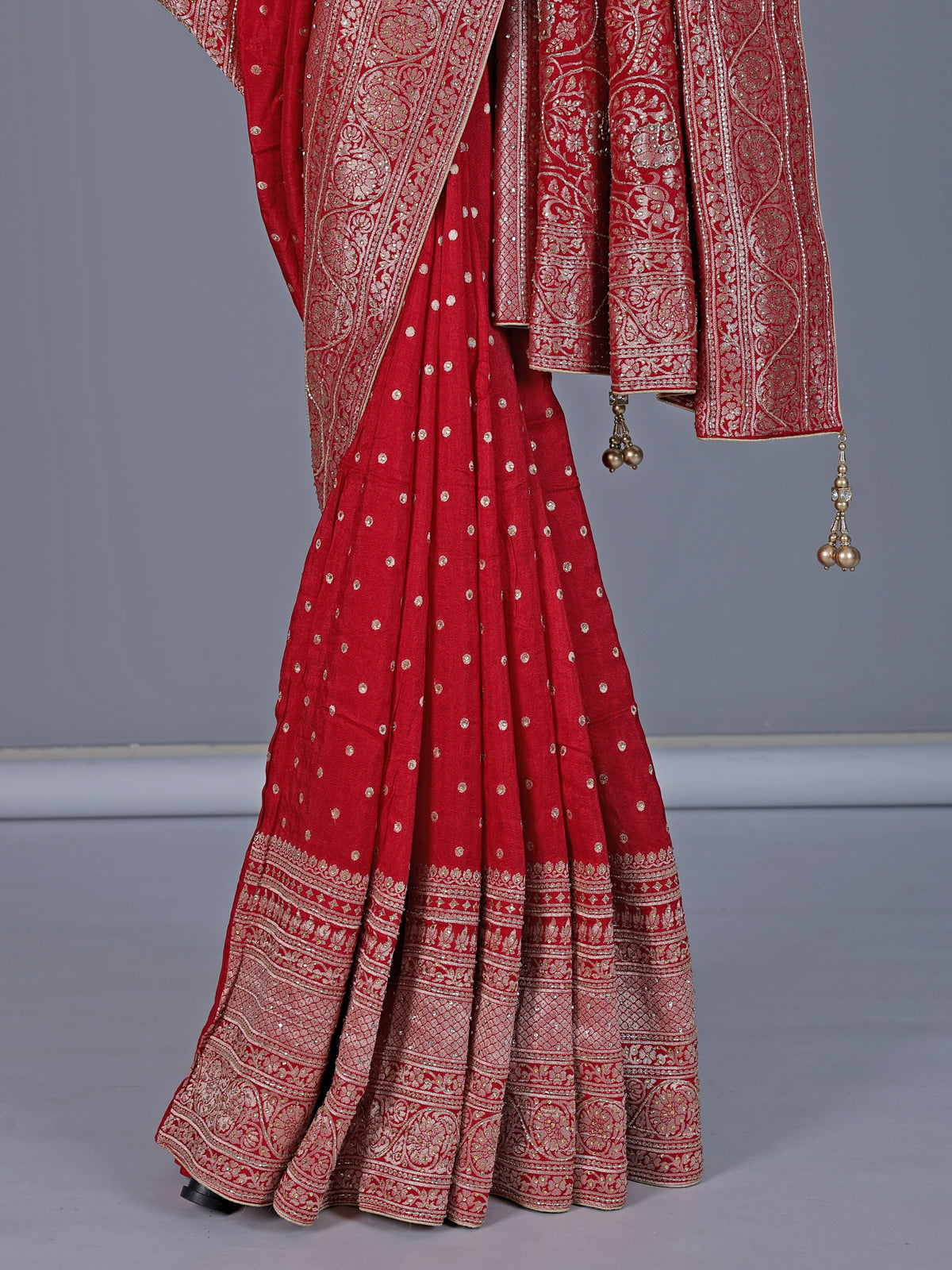 Red dola silk saree with elegant zari butti detailing