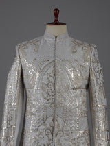 Light grey silk sherwani with elephant motif elegance