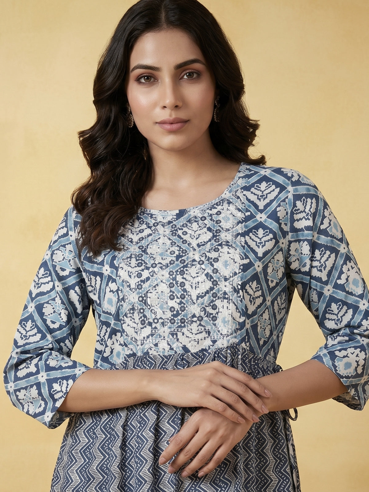 Blue printed cotton kurti designed with worked yoke pattern