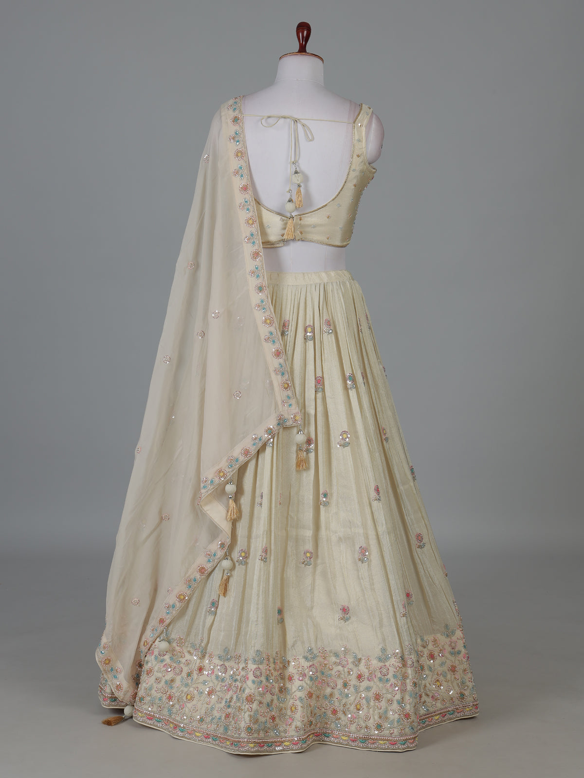 Cream silk lehenga choli with delicate embroidery
