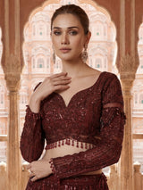 Maroon net lehenga choli with intricate handwork