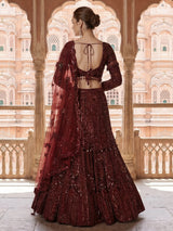Maroon net lehenga choli with intricate handwork