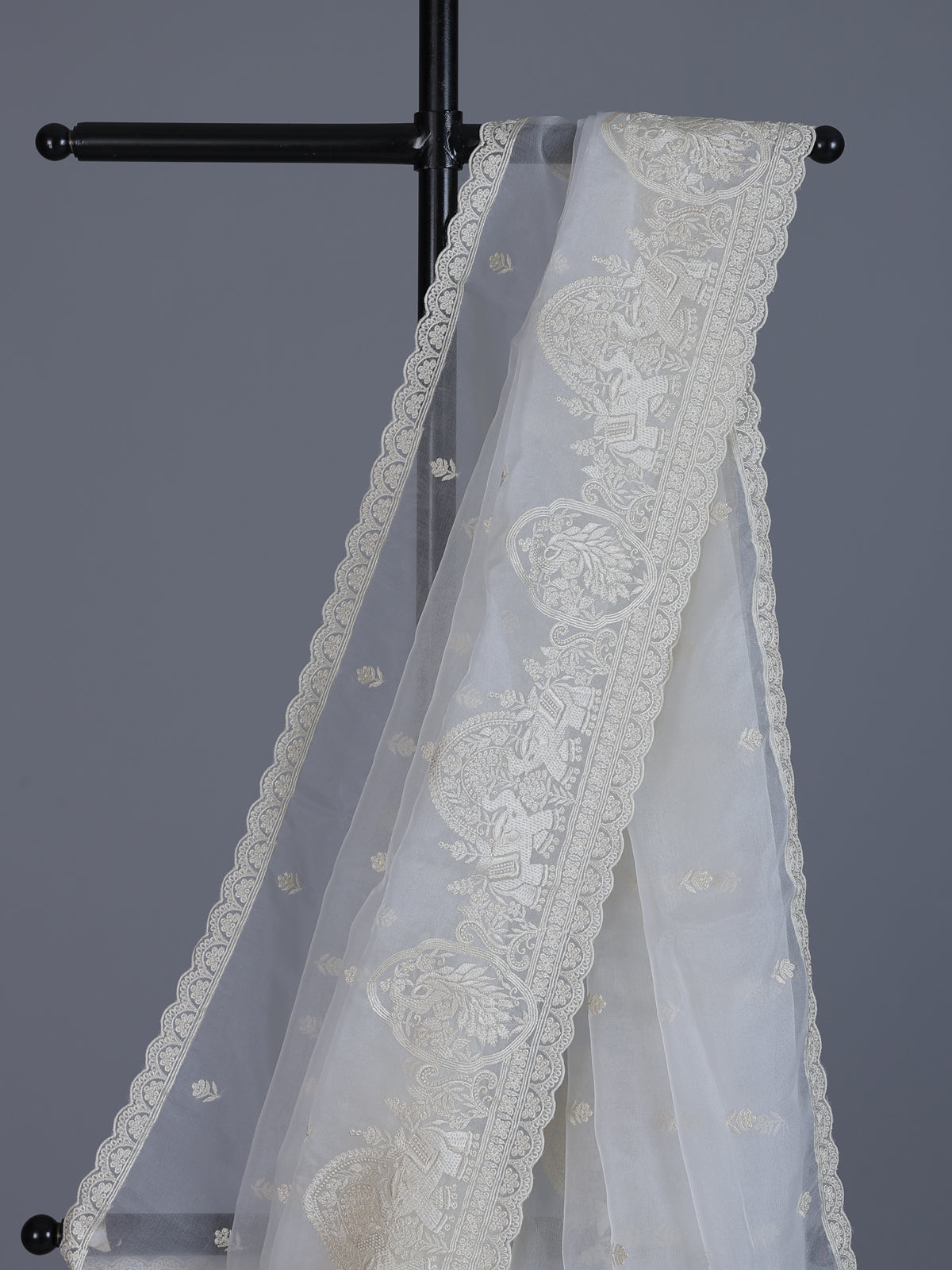 White organza tissue saree with graceful embroidered festive elegance