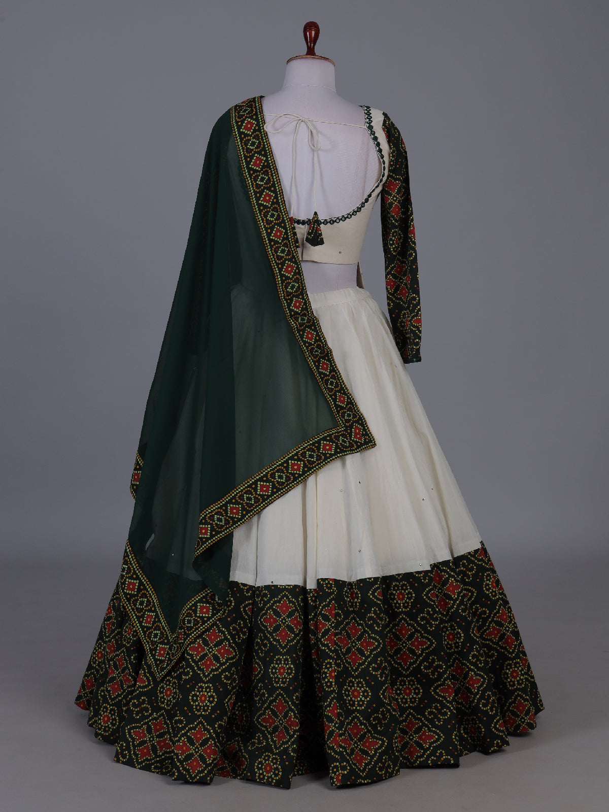 Dark green patola inspired lehenga festive splendor