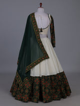 Dark green patola inspired lehenga festive splendor