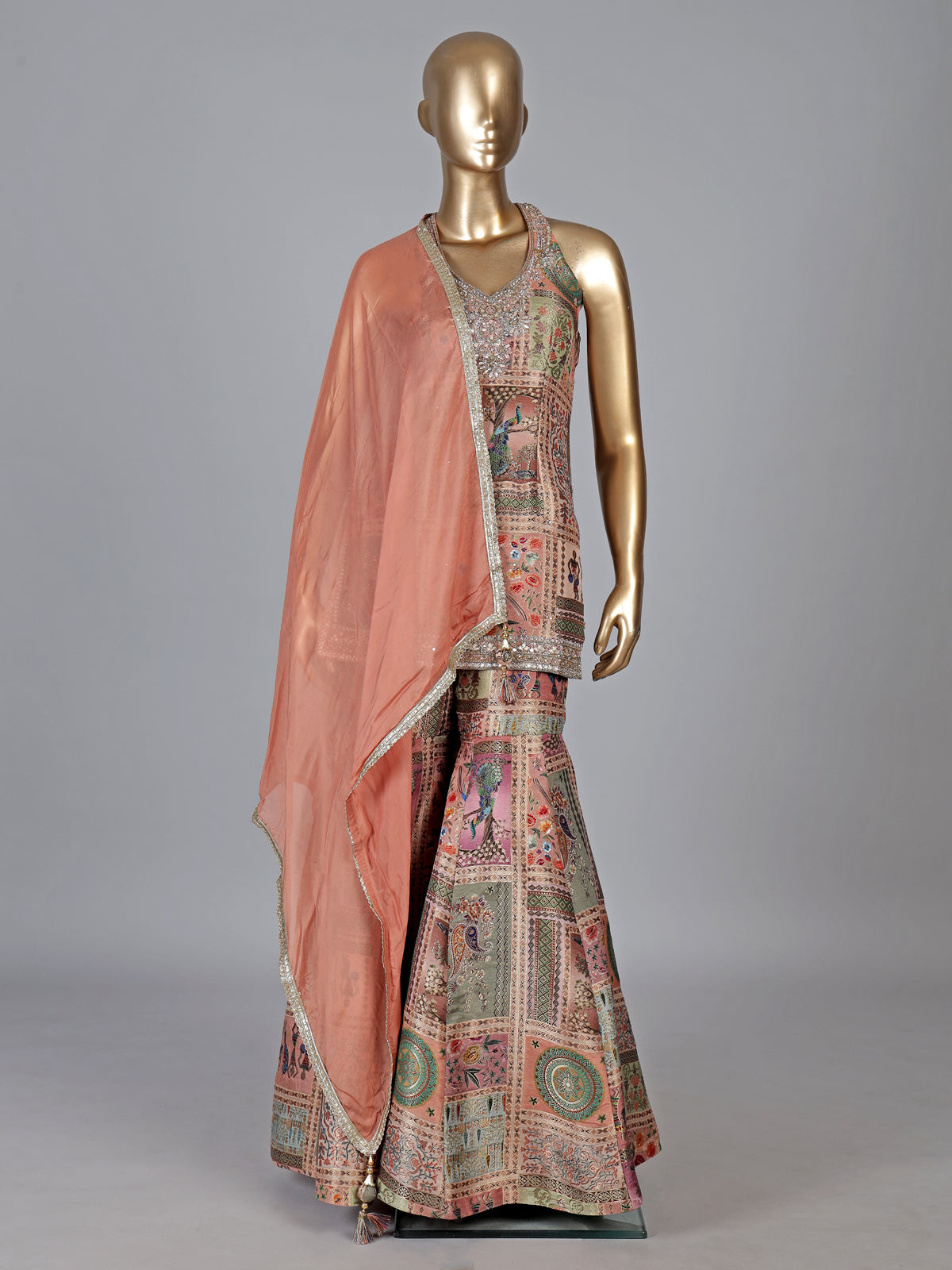 Pastel peach silk sharara suit with rich embellishment