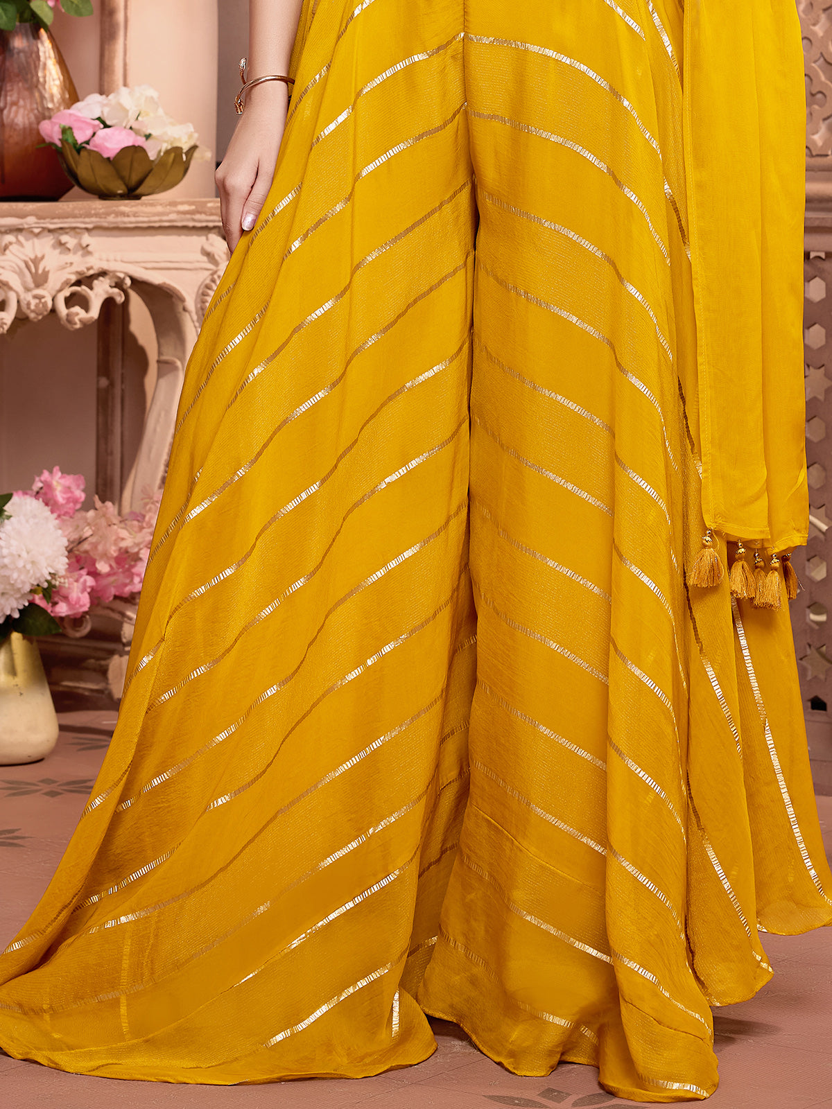Yellow silk palazzo suit with rich embellish choli