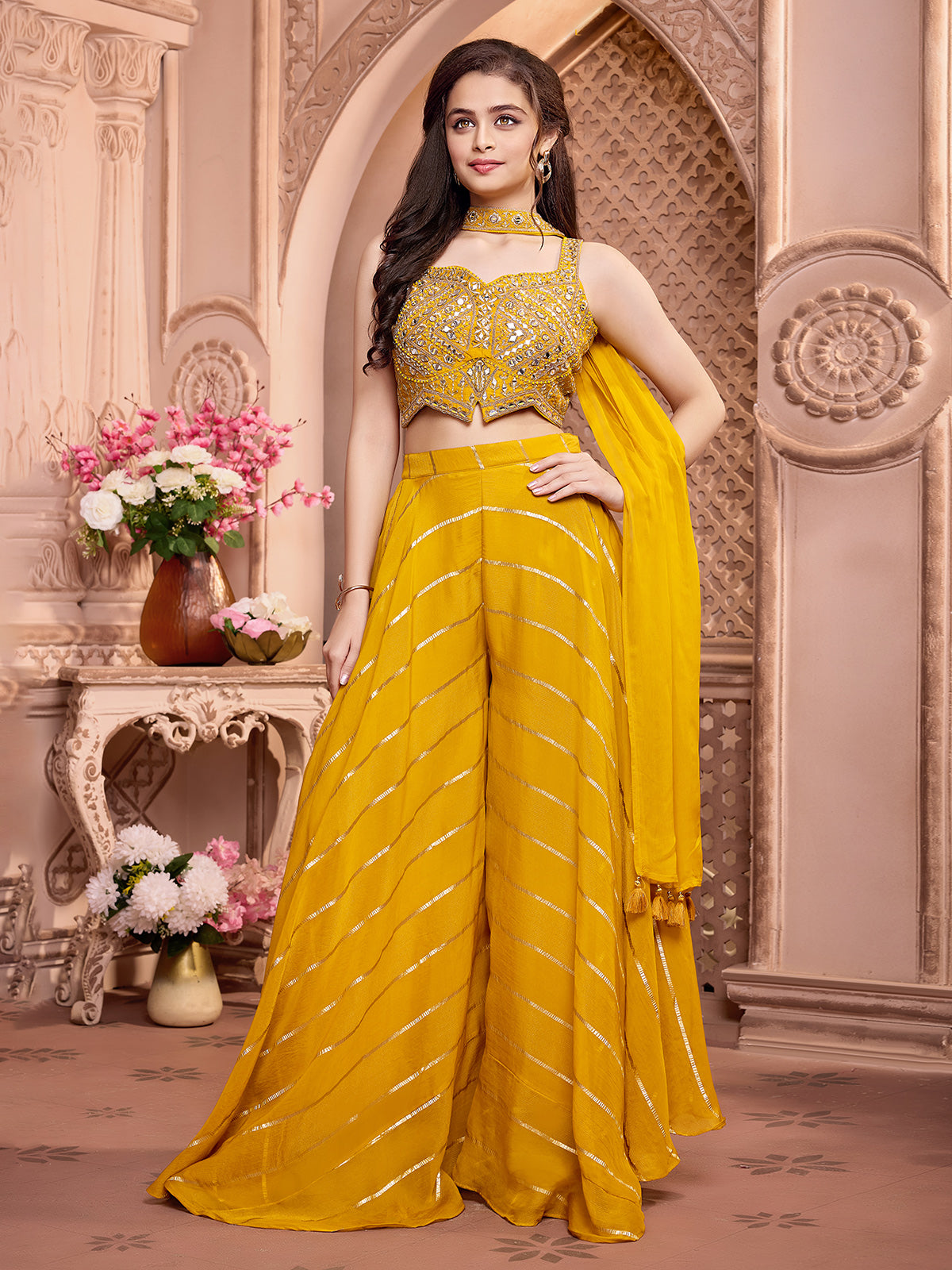 Yellow silk palazzo suit with rich embellish choli
