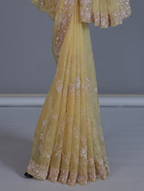Yellow tissue silk saree with sequins and cutdana work