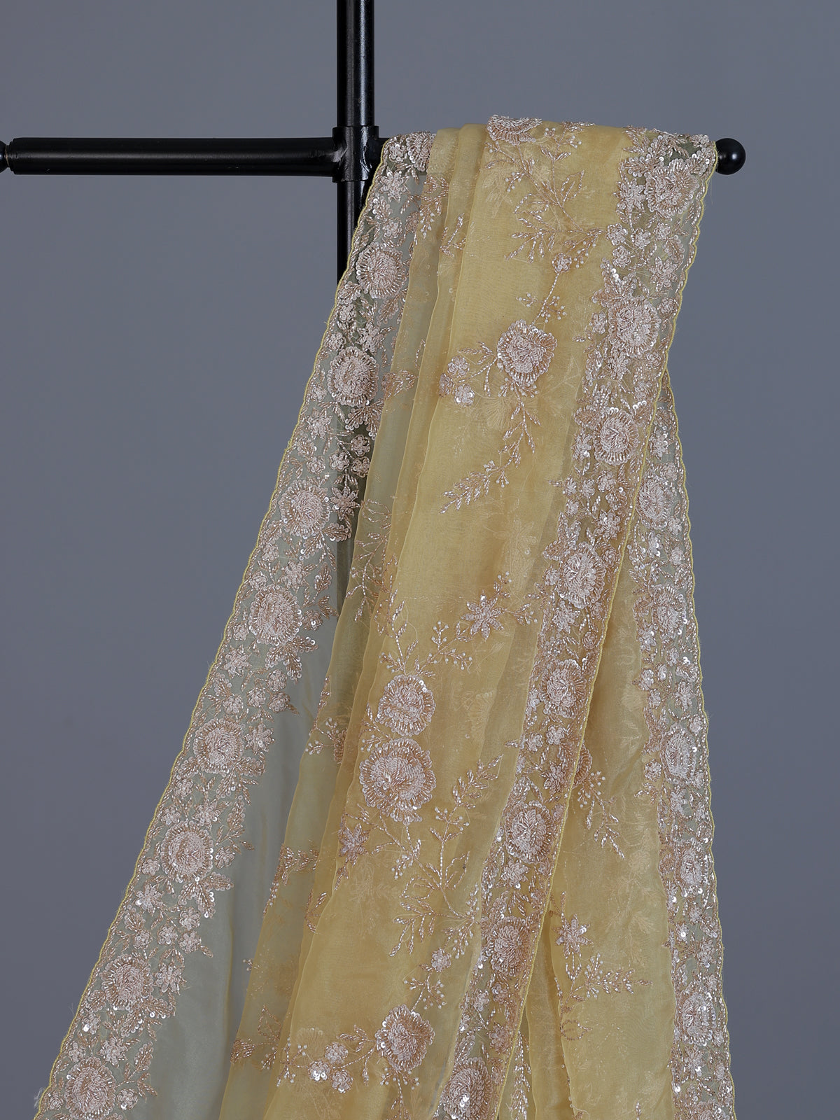 Yellow tissue silk saree with sequins and cutdana work