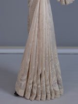 Beige tissue silk reception wear saree with cutdana work