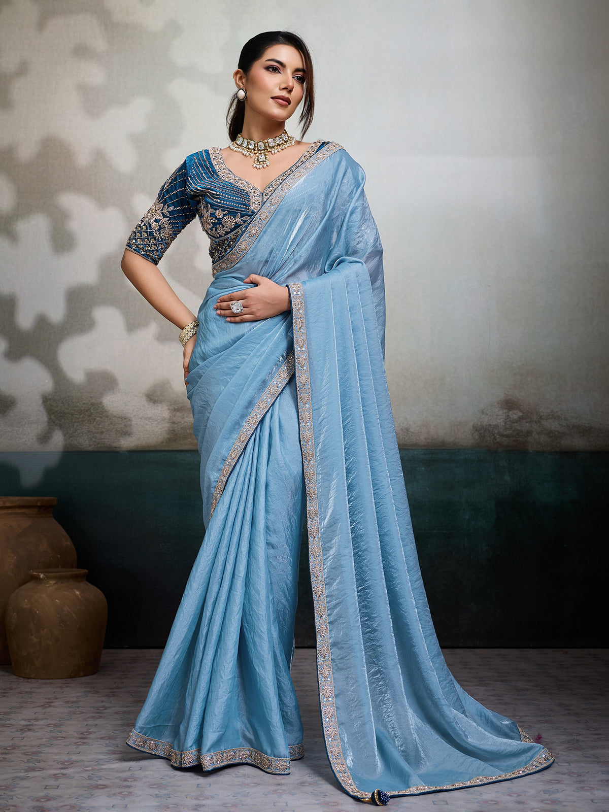 Sky blue satin saree with embroidered border