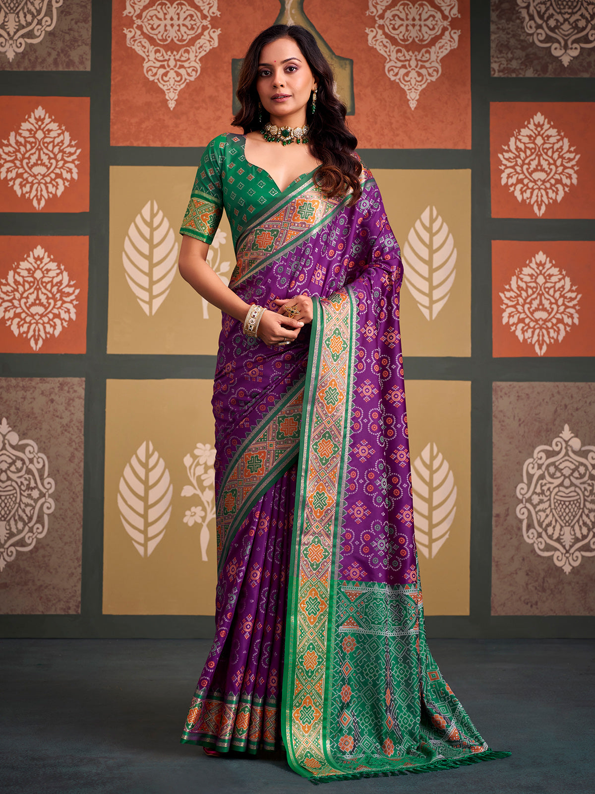 Imperial purple bandhani patola silk saree with contrast green blouse