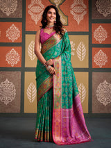 Regal green geometric patola silk saree with contrast pink blouse