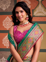 Regal green geometric patola silk saree with contrast pink blouse