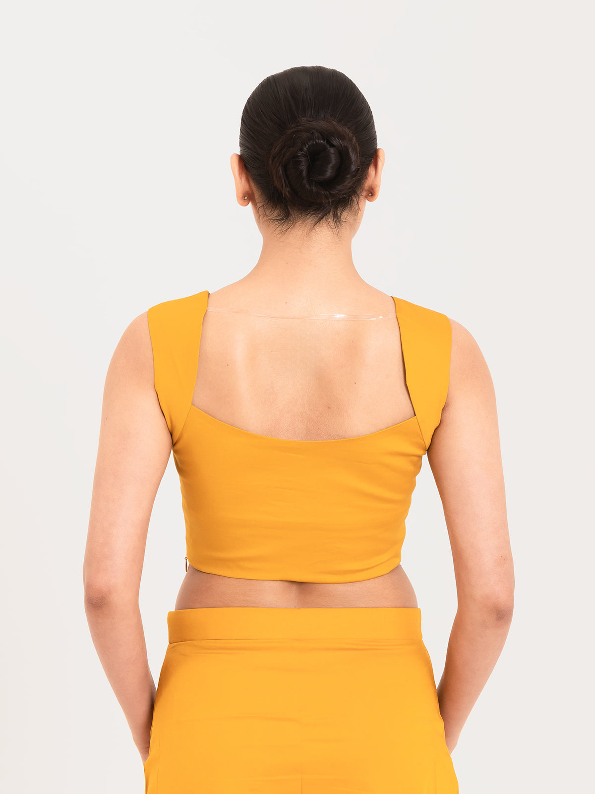 Yellow cotton lycra curved sweetheart neck sleeveless blouse