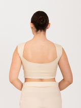 White cotton lycra curved sweetheart neck sleeveless blouse