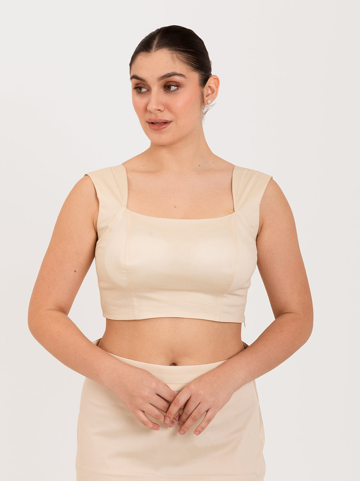 White cotton lycra curved sweetheart neck sleeveless blouse