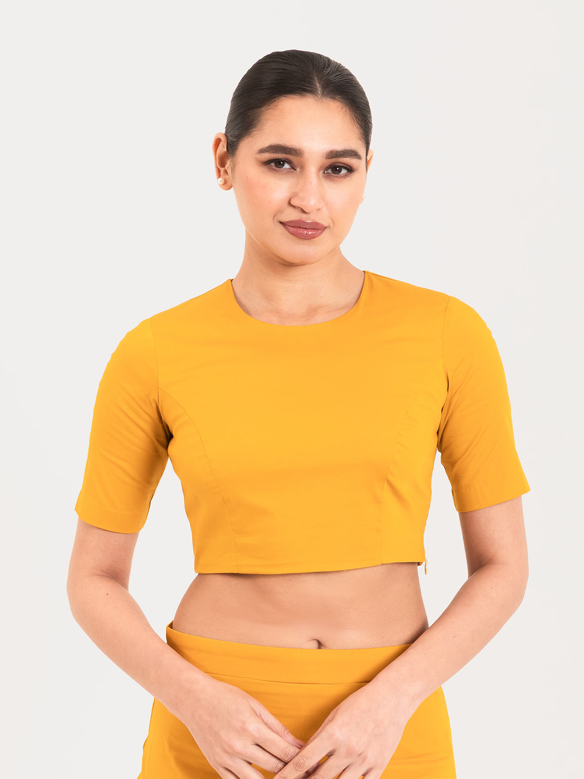 Yellow cotton lycra round neck sleeveless blouse