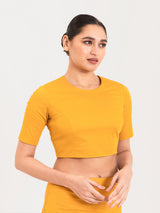 Yellow cotton lycra round neck sleeveless blouse